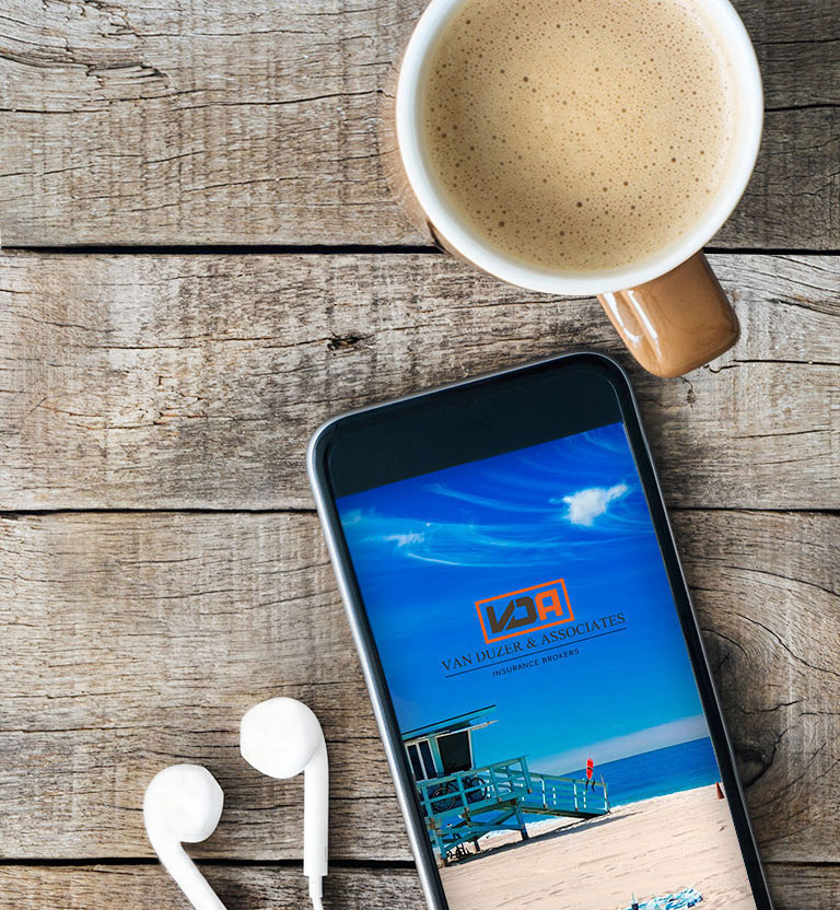 This image depicts a cellphone on a table next to a cup of coffee. Contacting us is quick and easy